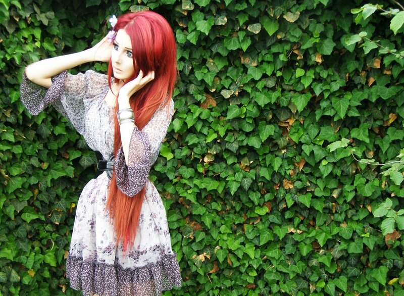 woman with red hair in garden