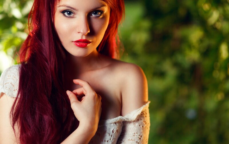 woman with red hair in garden