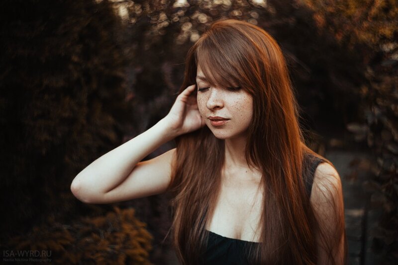 woman with red hair in garden