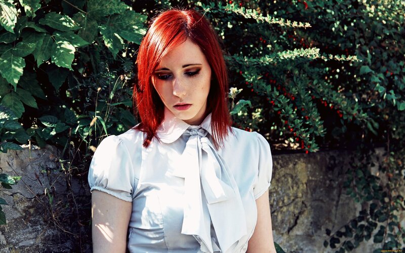 woman with red hair in garden
