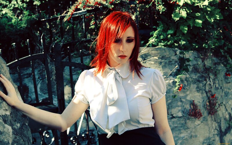 woman with red hair in garden