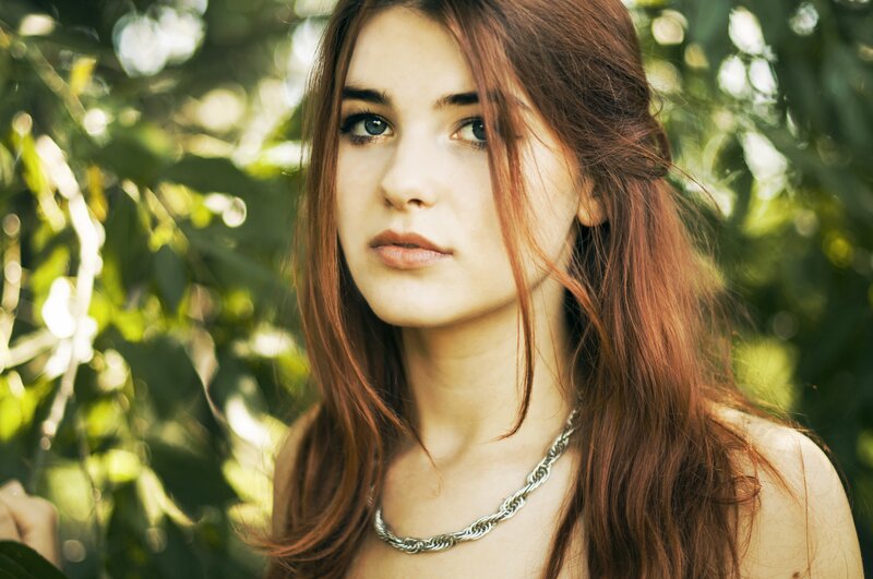 woman with red hair in garden