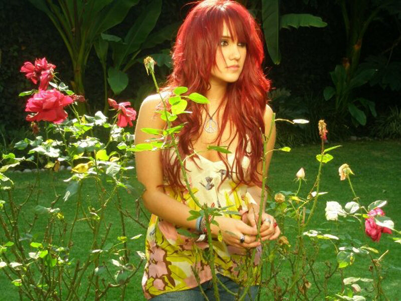 woman with red hair in garden