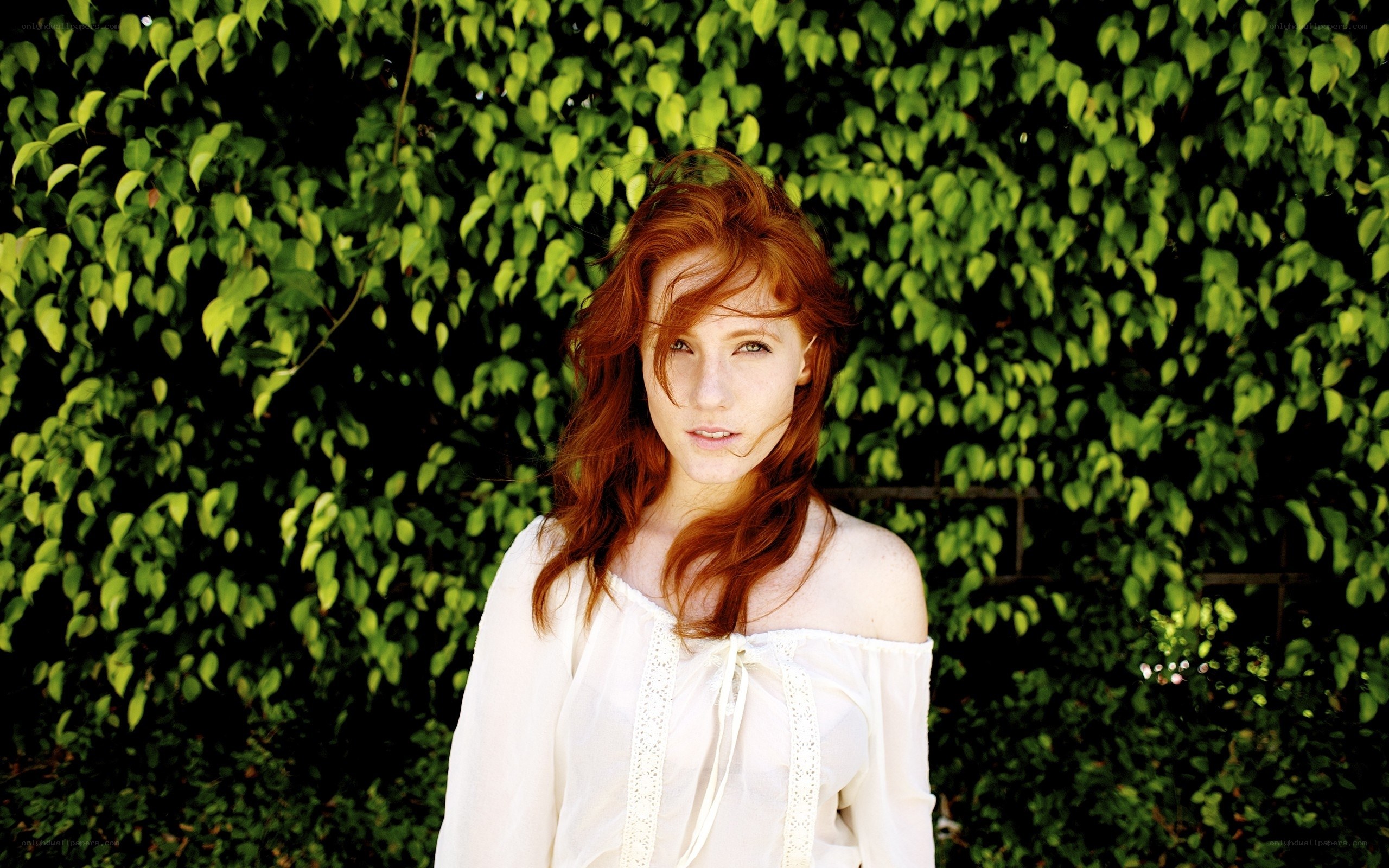 woman with red hair in greenery