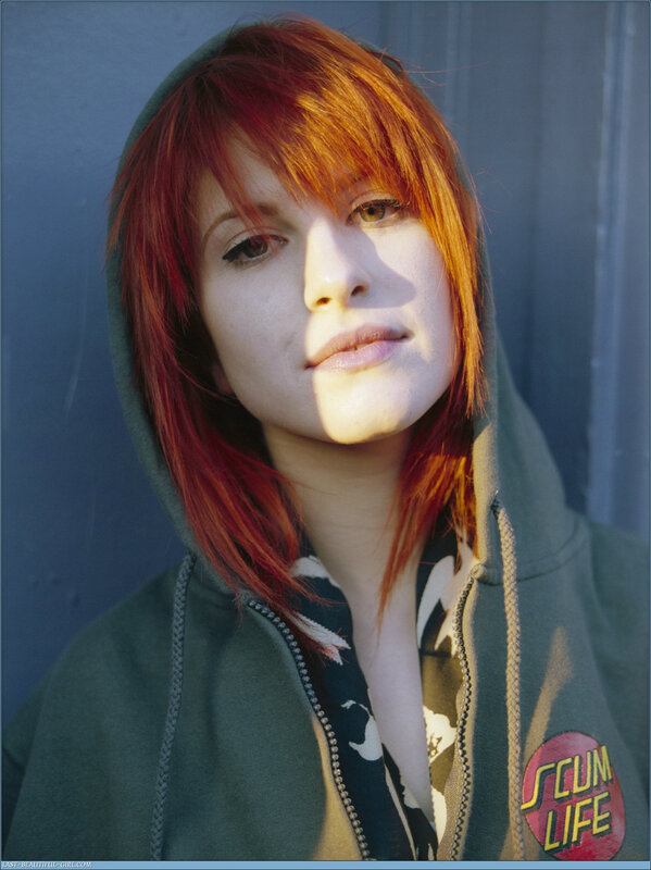woman with red hair in hoodie