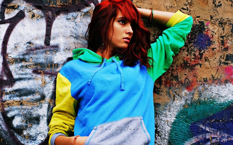woman with red hair in hoodie