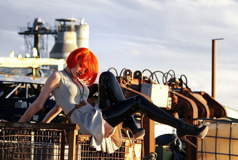 woman with red hair in industrial setting