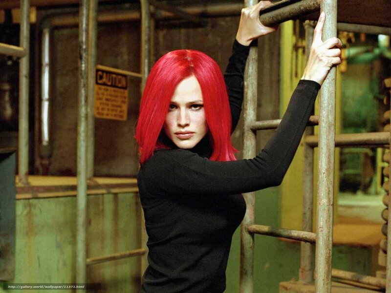 Woman with red hair in industrial setting