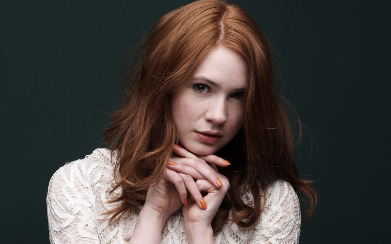 woman with red hair in lace dress