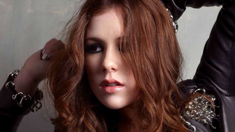 woman with red hair in leather jacket