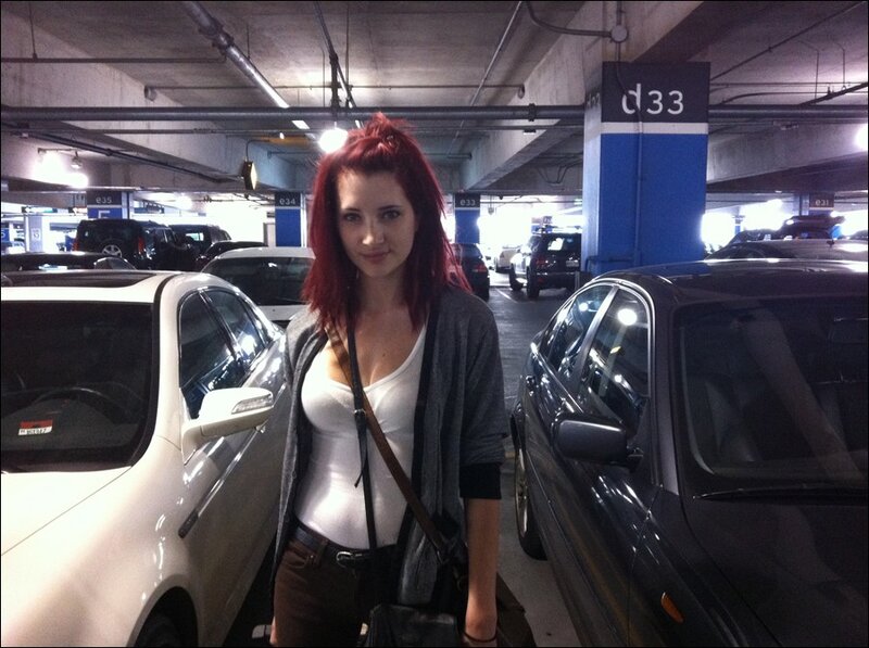 Woman with red hair in parking garage