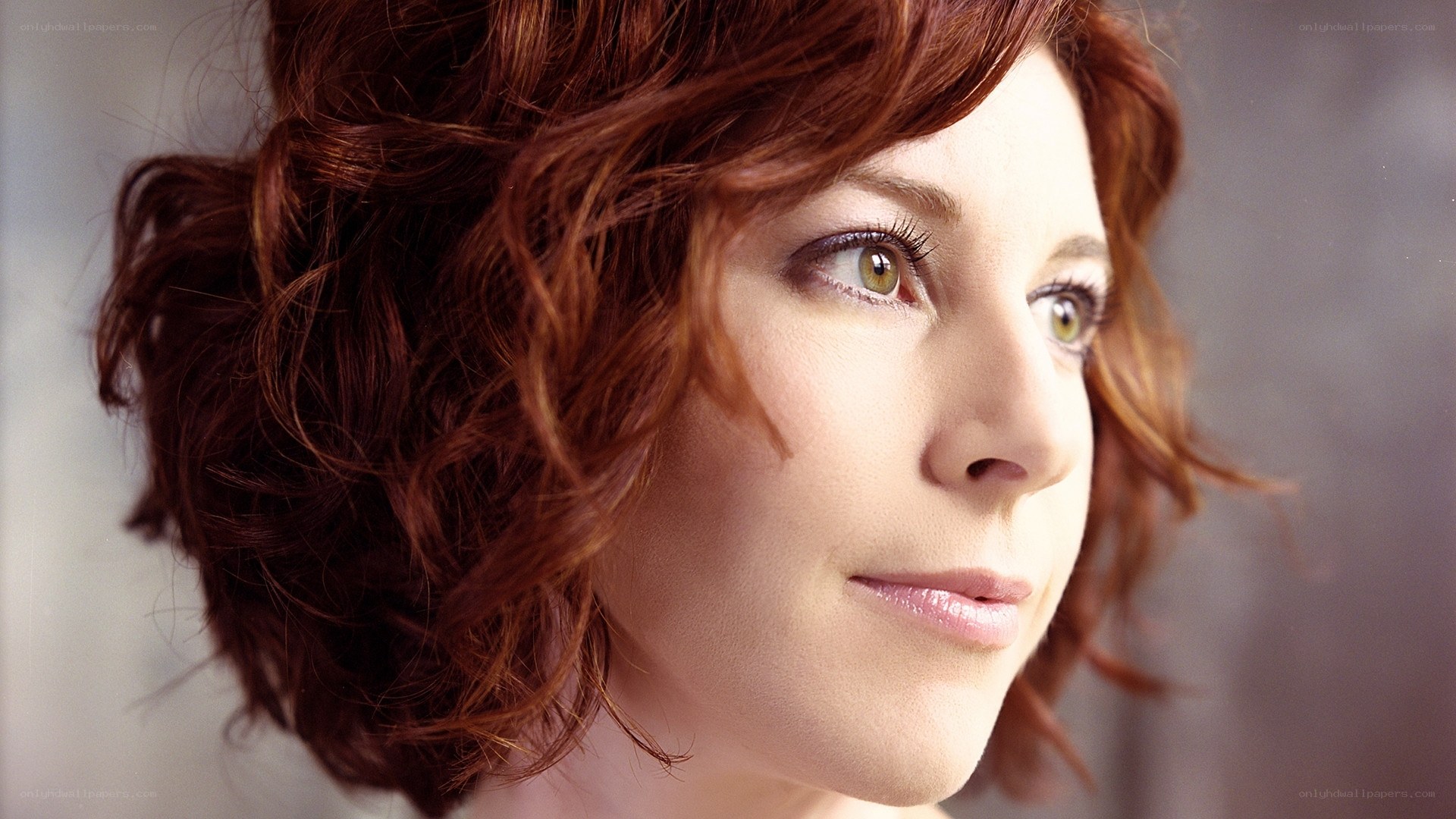 woman with red hair in profile