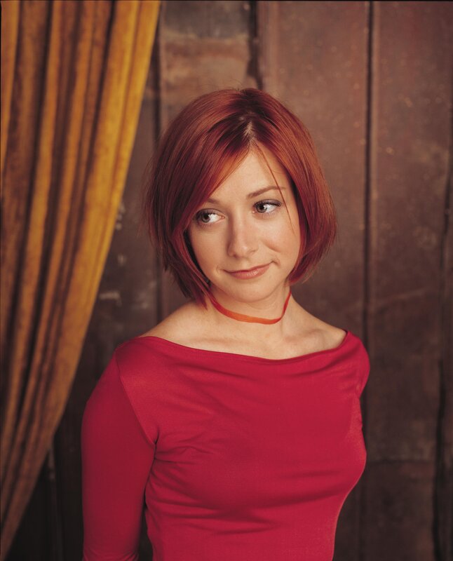 woman with red hair in red top