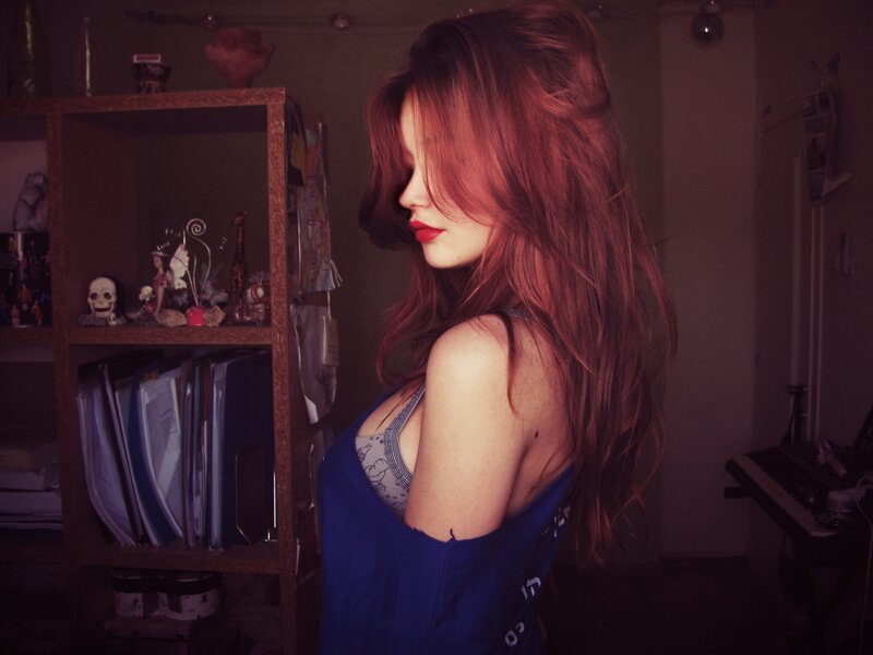 woman with red hair in room