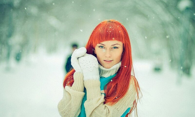 woman with red hair in snow
