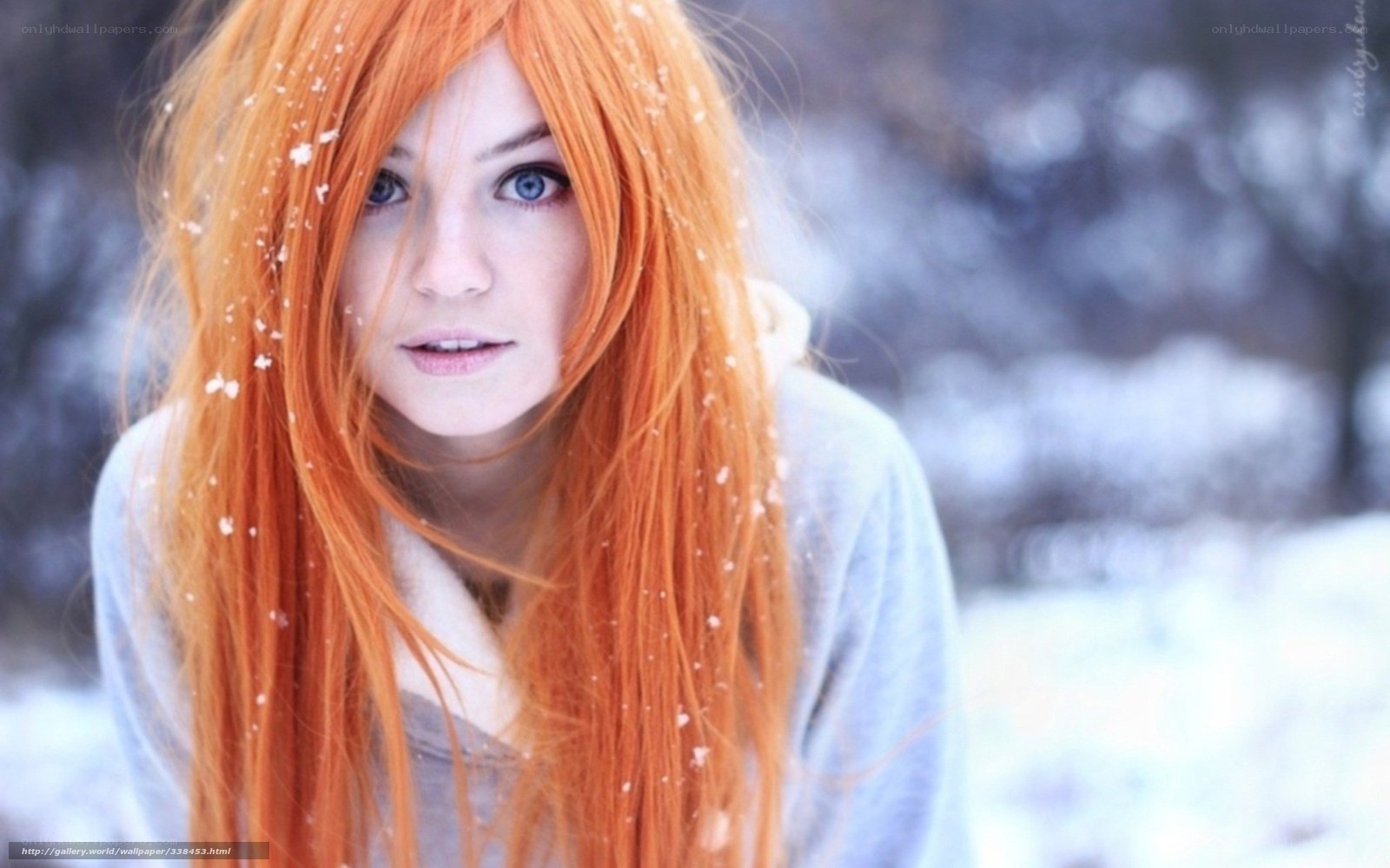 woman with red hair in snow