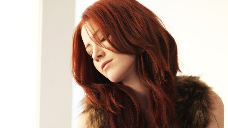 woman with red hair in soft light