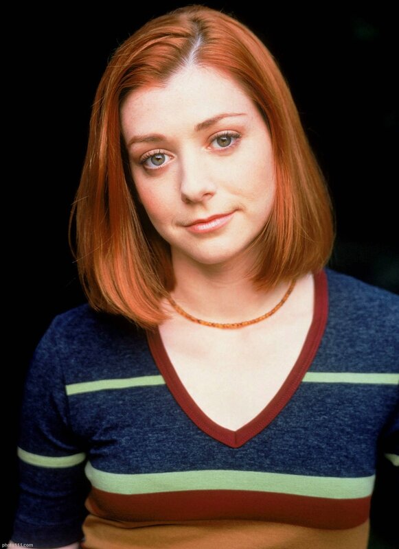woman with red hair in striped shirt