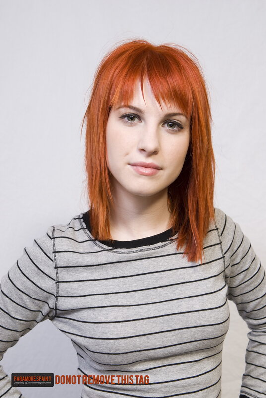 woman with red hair in striped shirt