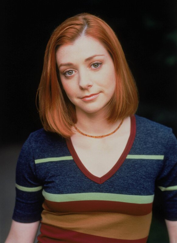 woman with red hair in striped shirt