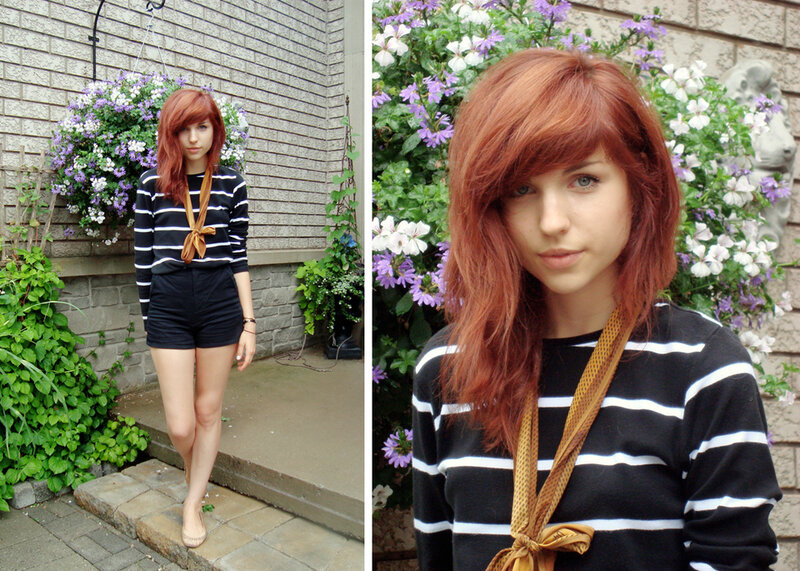 woman with red hair in striped sweater