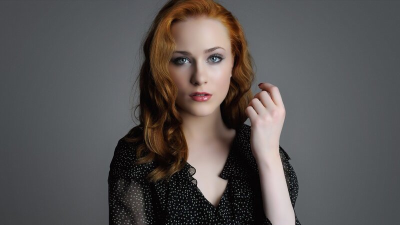 woman with red hair in studio