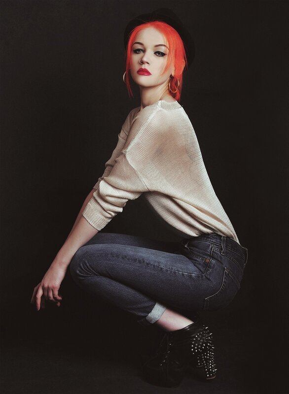 woman with red hair in studio