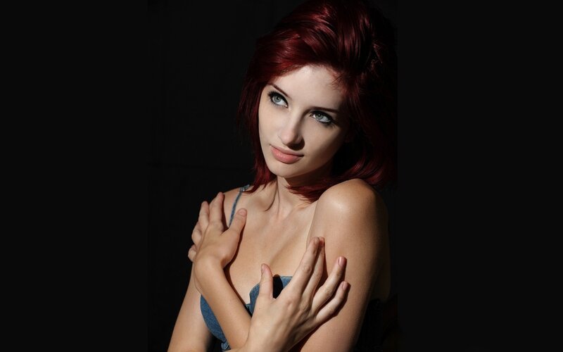 woman with red hair in studio