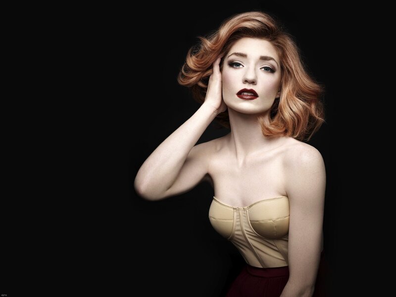 woman with red hair in studio