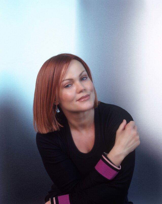 woman with red hair in studio