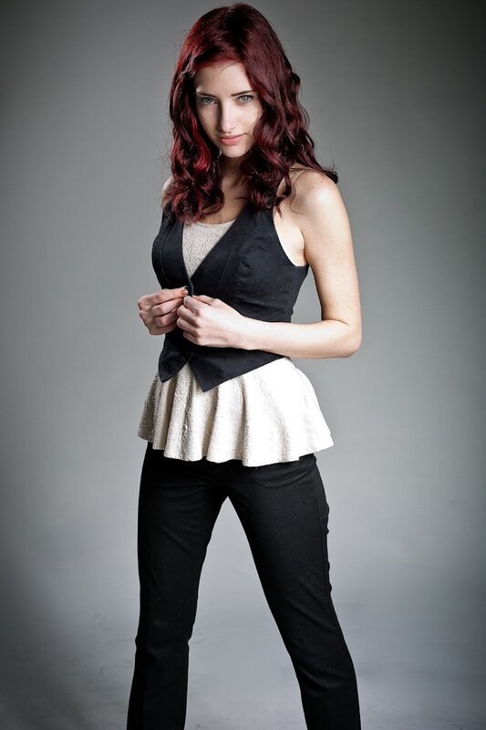 woman with red hair in studio
