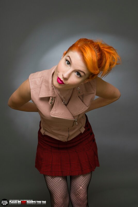 woman with red hair in studio