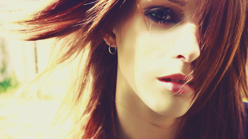 woman with red hair in sunlight