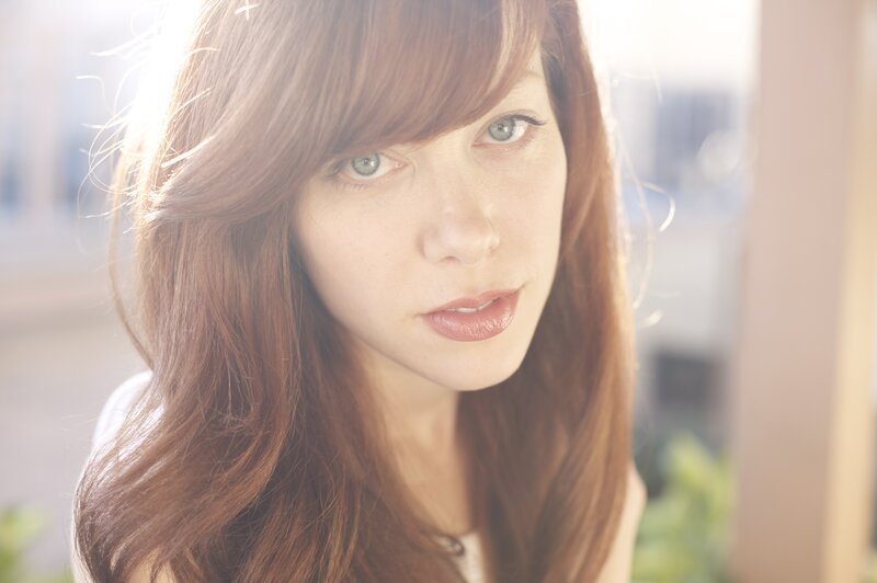 woman with red hair in sunlight