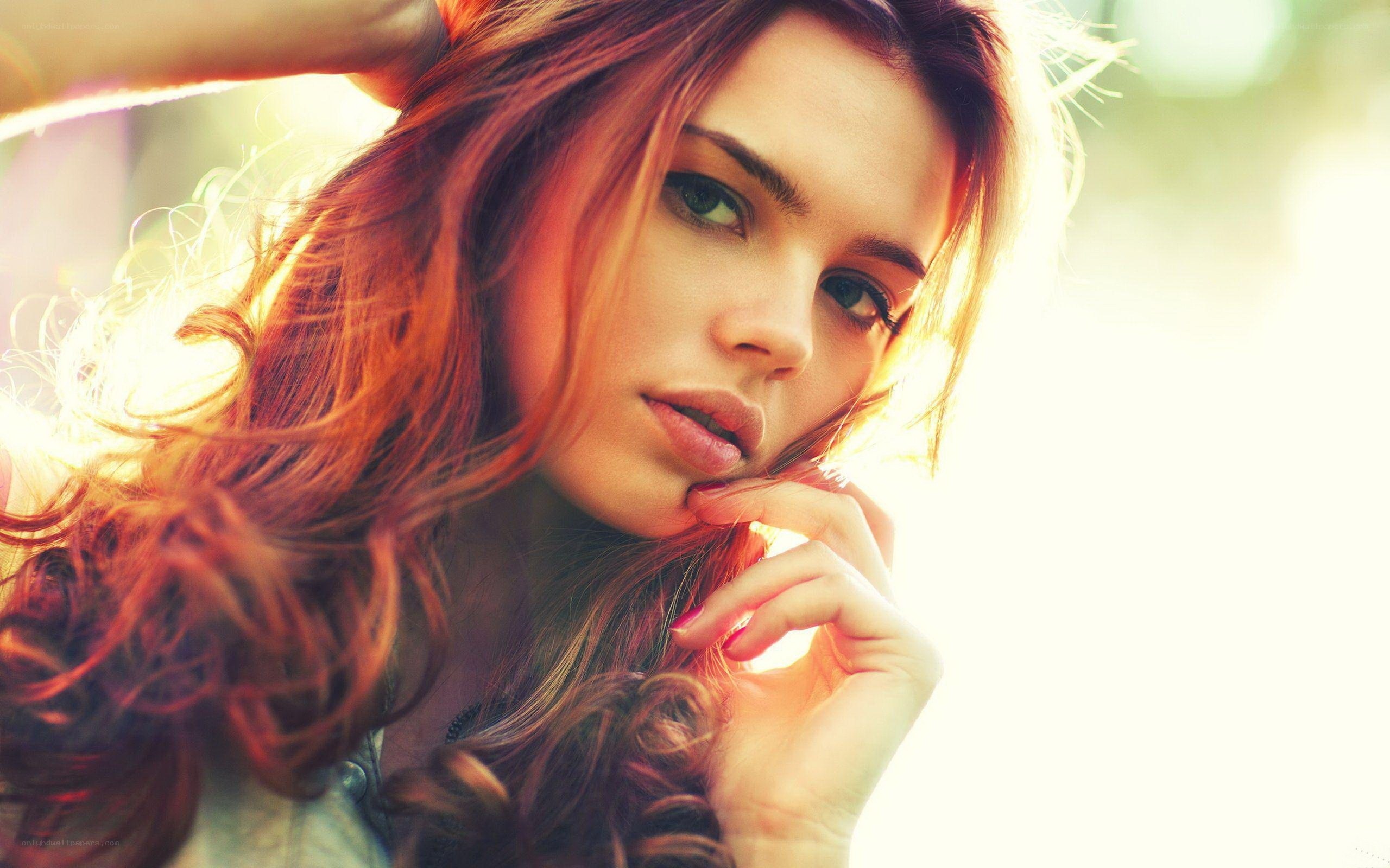 woman with red hair in sunlight