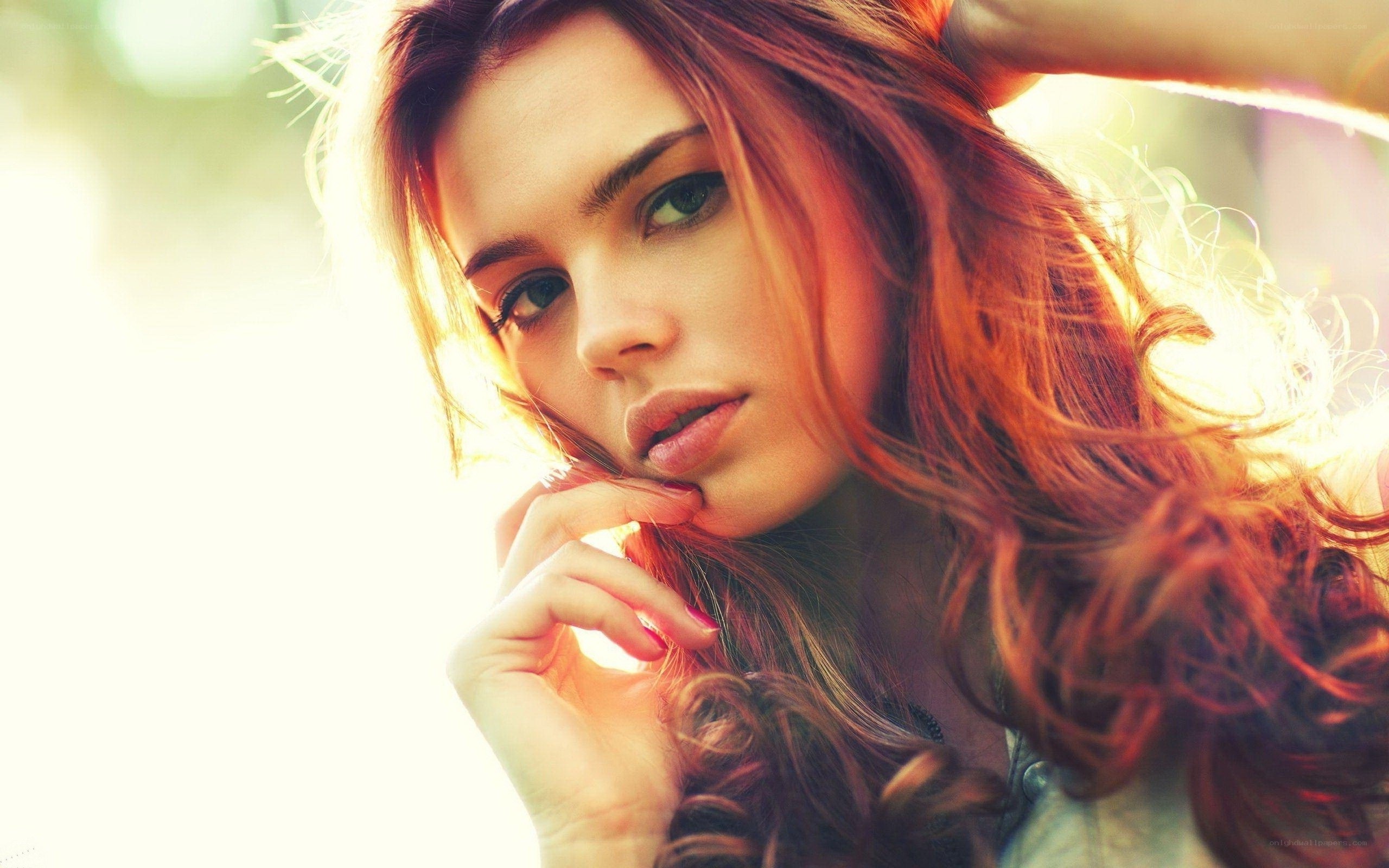 woman with red hair in sunlight