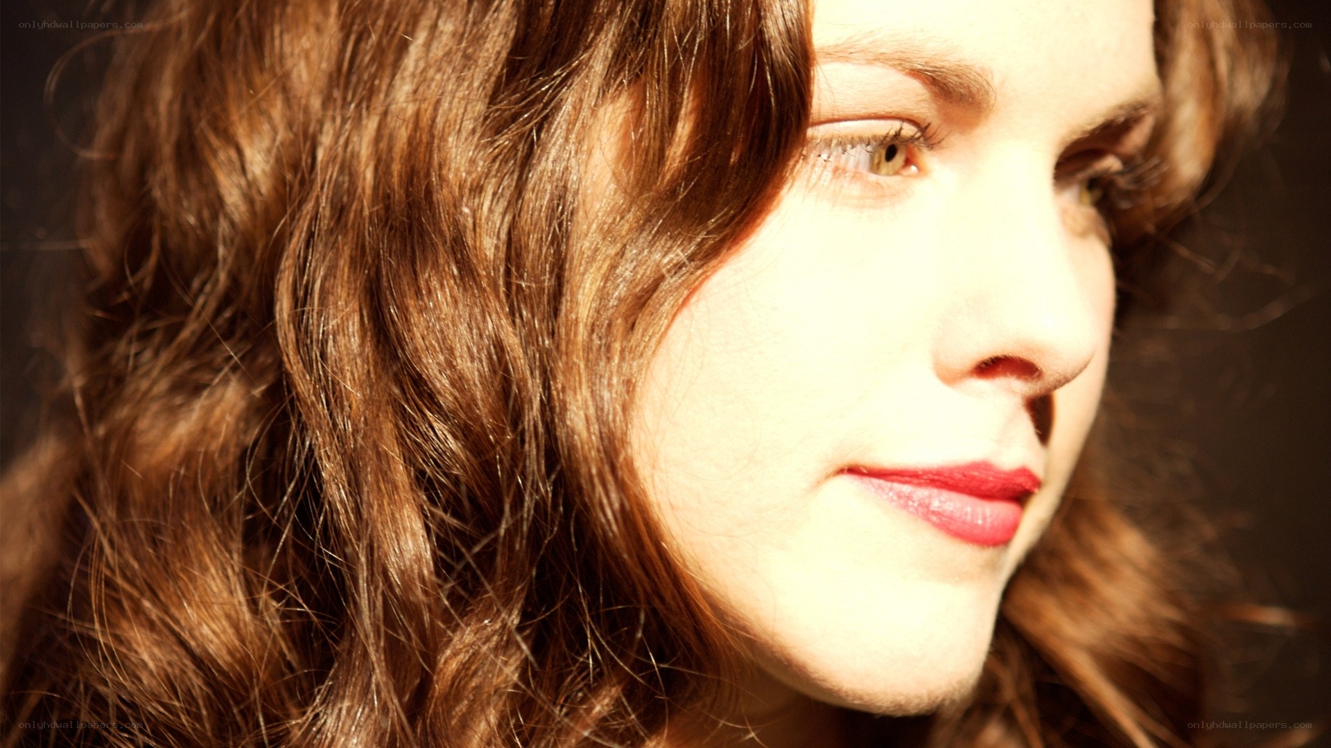 woman with red hair in sunlight