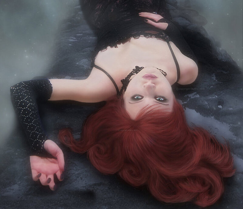woman with red hair in water