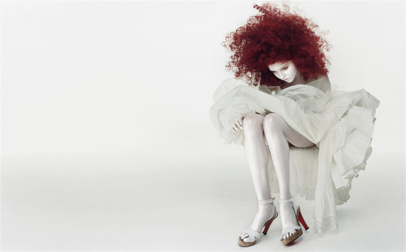 woman with red hair in white dress
