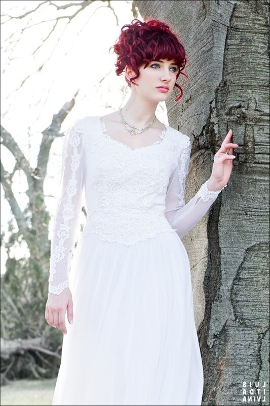 Woman with red hair in white dress