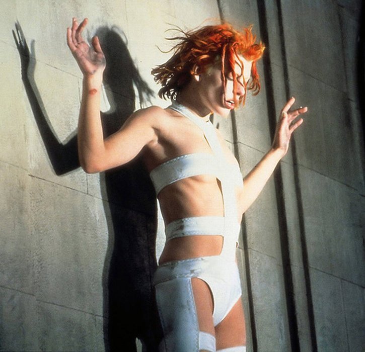 woman with red hair in white outfit