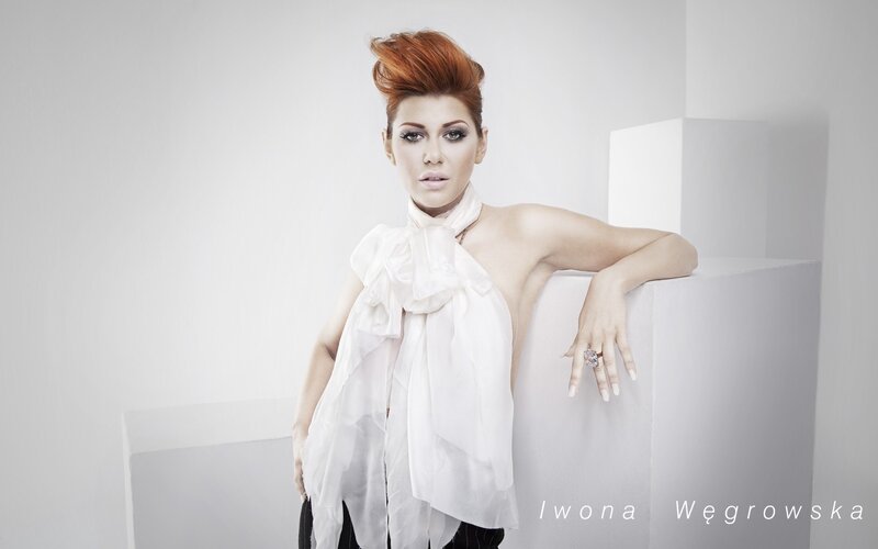 woman with red hair in white setting