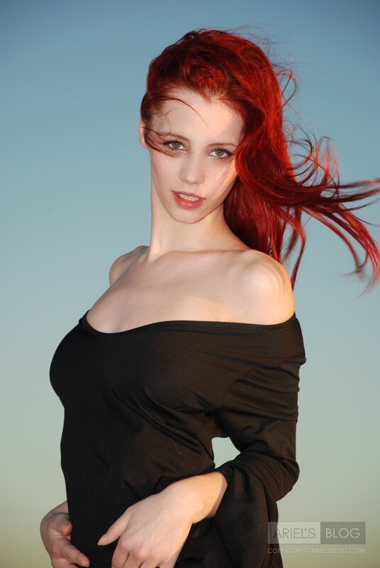woman with red hair in wind