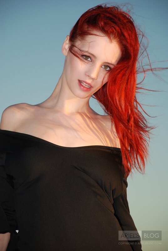 woman with red hair in wind