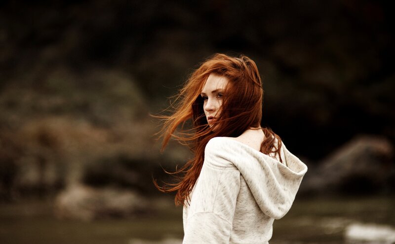 woman with red hair in wind