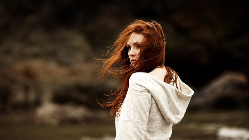 woman with red hair in wind