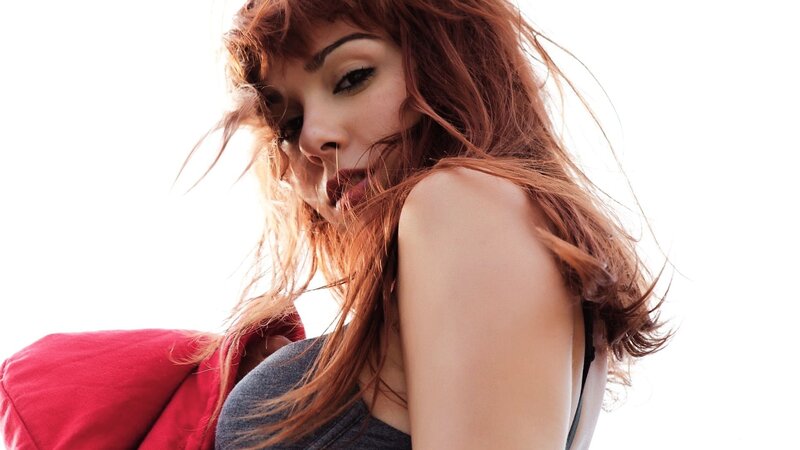 woman with red hair in wind