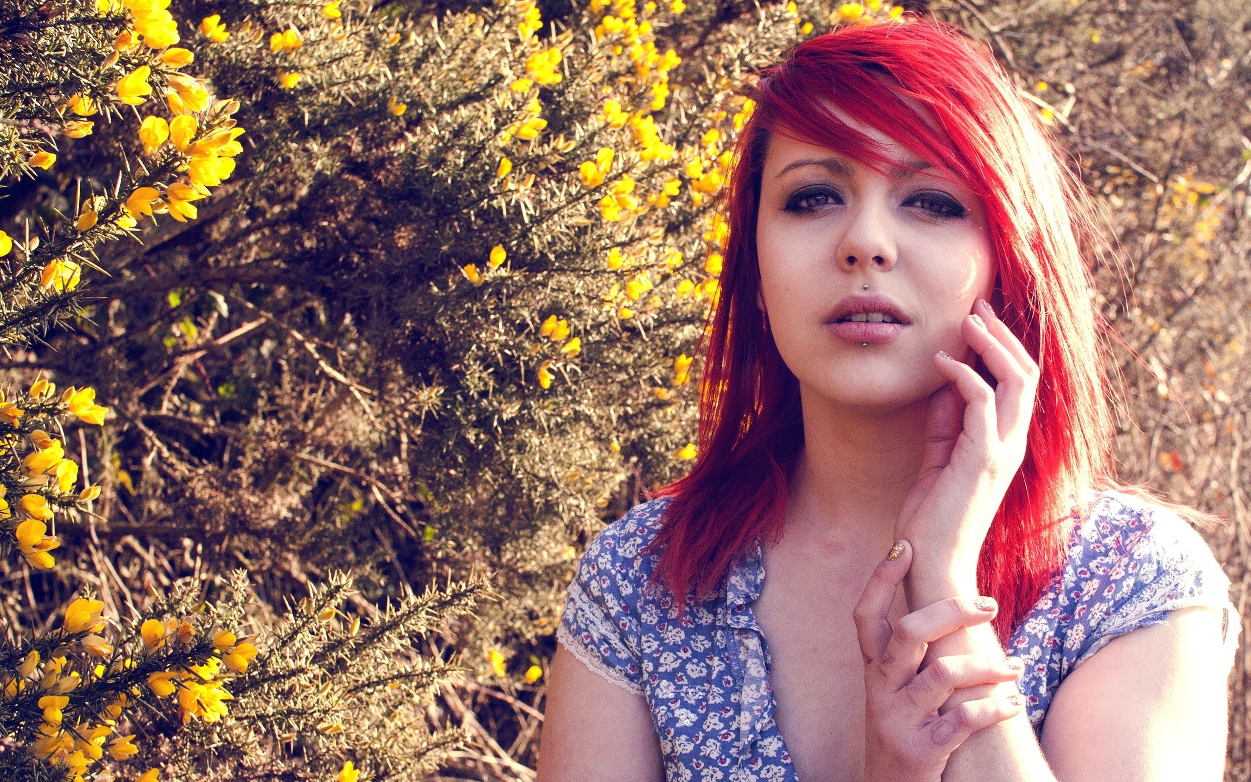 woman with red hair in yellow flowers