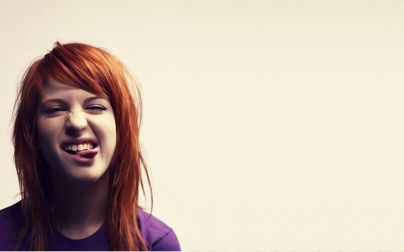 woman with red hair laughing