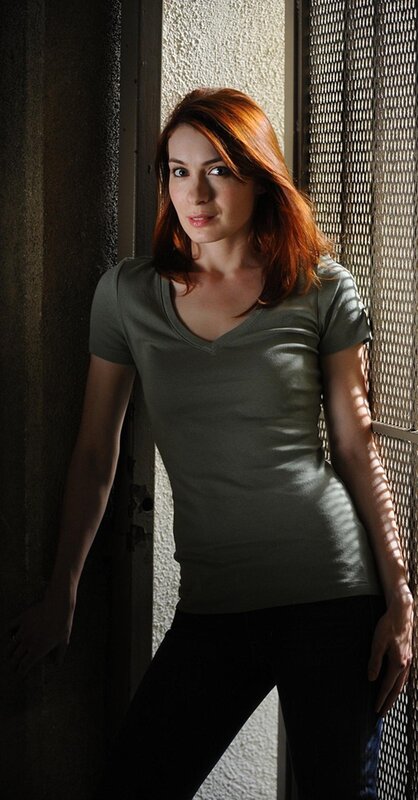 woman with red hair leaning
